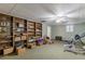 Spacious carpeted basement with large bookshelf at 180 Winecoff Dr, Fayetteville, GA 30214