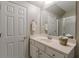 Neat bathroom with a bright vanity and a large mirror, with a clean and functional design at 180 Winecoff Dr, Fayetteville, GA 30214