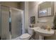 Bathroom with a shower and a pedestal sink at 180 Winecoff Dr, Fayetteville, GA 30214