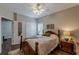 Bedroom with hardwood floors, ceiling fan and access to other rooms at 180 Winecoff Dr, Fayetteville, GA 30214