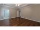 Bedroom with hardwood floors, ceiling fan, and ensuite bathroom at 180 Winecoff Dr, Fayetteville, GA 30214
