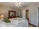 Bedroom with a ceiling fan and view to the bathroom at 180 Winecoff Dr, Fayetteville, GA 30214