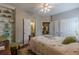 Bedroom features a ceiling fan, hardwood floors, and a built-in display case at 180 Winecoff Dr, Fayetteville, GA 30214