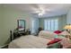 Charming bedroom with two beds, a mirror, and neutral walls providing a serene space at 180 Winecoff Dr, Fayetteville, GA 30214