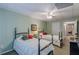 Comfortable bedroom featuring two beds, ceiling fan, and neutral walls, creating a peaceful retreat at 180 Winecoff Dr, Fayetteville, GA 30214