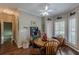 Breakfast nook features a round wood table and a bay window at 180 Winecoff Dr, Fayetteville, GA 30214