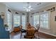 Bright breakfast nook with hardwood floors and large shuttered windows at 180 Winecoff Dr, Fayetteville, GA 30214