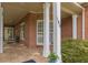 Inviting front porch with tiled flooring, white columns, and view of the front door at 180 Winecoff Dr, Fayetteville, GA 30214