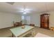 Game room is large and spacious with a rustic green table at 180 Winecoff Dr, Fayetteville, GA 30214