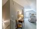Hallway with view of a carpeted bedroom and lamp lit side table at 180 Winecoff Dr, Fayetteville, GA 30214