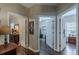 Hallway view with hardwood floors and access to multiple rooms at 180 Winecoff Dr, Fayetteville, GA 30214