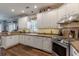 Charming kitchen with white cabinets, stainless steel appliances, and plenty of counter space at 180 Winecoff Dr, Fayetteville, GA 30214