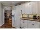 Kitchen area with white cabinets and ample counter space at 180 Winecoff Dr, Fayetteville, GA 30214
