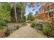 Stunning landscape featuring a garden with benches, gravel path, and vibrant foliage at 180 Winecoff Dr, Fayetteville, GA 30214