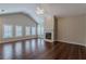 Inviting living room with hardwood floors, fireplace, and abundant natural light, ideal for relaxation at 180 Winecoff Dr, Fayetteville, GA 30214