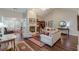 Bright living room features hardwood floors, fireplace, and large windows at 180 Winecoff Dr, Fayetteville, GA 30214