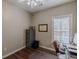 Neutral toned office with a ceiling fan, hardwood floors and a window to let in natural light at 180 Winecoff Dr, Fayetteville, GA 30214