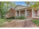 Brick home with a screened-in porch and a meticulously landscaped backyard at 180 Winecoff Dr, Fayetteville, GA 30214