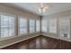 Sunroom with hardwood floors, ceiling fan, and window shutters at 180 Winecoff Dr, Fayetteville, GA 30214