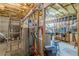 View of the unfinished basement, showcasing insulation and exposed structural elements at 180 Winecoff Dr, Fayetteville, GA 30214