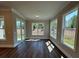 Bright sunroom with wood floors, lots of windows and a sliding door leading to the outside at 184 Vinca Nw Cir, Kennesaw, GA 30144
