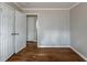 Neutral bedroom featuring hardwood floors and view into hallway at 1561 Rupert Rd, Decatur, GA 30032