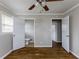 Bedroom with hardwood floors features two closets with white doors at 1561 Rupert Rd, Decatur, GA 30032