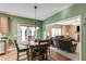 Charming dining area with hardwood floors, view to the living room, and doors leading to the backyard at 315 Hunters Trce, Dallas, GA 30157