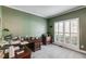 Bright home office with built-in desk, natural light, and plantation shutters at 315 Hunters Trce, Dallas, GA 30157