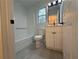 Bathroom with a white vanity, black hardware, and a shower and tub combo at 3663 Heatherwood Ne Dr, Marietta, GA 30066
