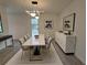 Dining room featuring a modern light fixture and a large marble dining table at 3663 Heatherwood Ne Dr, Marietta, GA 30066