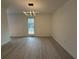 Open living room featuring hardwood floors and natural light from a large window at 3663 Heatherwood Ne Dr, Marietta, GA 30066