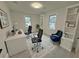 Home office featuring large windows, two black office chairs and a built in bookcase at 3663 Heatherwood Ne Dr, Marietta, GA 30066