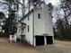 View of the rear of the home showcasing a two-car garage at 3663 Heatherwood Ne Dr, Marietta, GA 30066
