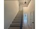 Staircase with natural light, leading to the upper level of the home at 3663 Heatherwood Ne Dr, Marietta, GA 30066