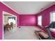 Bright living room with pink walls and white trim, providing a versatile space for relaxation or entertainment at 730 Cloverwood Nw Ct, Lilburn, GA 30047