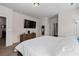 Main bedroom featuring neutral walls, carpet, and large flatscreen television at 23 Ponders Se Rd, Cartersville, GA 30121