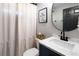 Cozy bathroom with marble countertop, sleek fixtures, and framed animal print at 4095 Copper Leaf Ln, Cumming, GA 30040