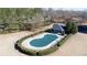 Aerial shot of a community pool with a cover on it, surrounded by a fence and landscaping at 4095 Copper Leaf Ln, Cumming, GA 30040