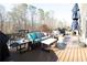 Comfortable outdoor deck featuring patio furniture, grill, and overhead umbrella at 4095 Copper Leaf Ln, Cumming, GA 30040