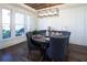 Charming dining room with a rustic wood ceiling and many windows for natural light at 4095 Copper Leaf Ln, Cumming, GA 30040