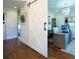 An open, light-filled home office with a decorative barn door and modern chandelier at 4095 Copper Leaf Ln, Cumming, GA 30040