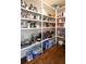 Extensive pantry shelving offering abundant storage capacity for a variety of food items and kitchen appliances at 4095 Copper Leaf Ln, Cumming, GA 30040