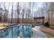 A luxury pool and backyard area for entertaining at 4095 Copper Leaf Ln, Cumming, GA 30040