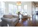 Bright, sun-filled sunroom features hardwood floors and an inviting atmosphere, perfect for relaxation at 4095 Copper Leaf Ln, Cumming, GA 30040