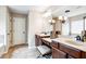 Bathroom featuring double sinks, dark wood cabinets, and tiled floor at 2600 Reece Farms Sw Trl, Powder Springs, GA 30127