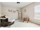 Cozy bedroom featuring a large window, carpet, and neutral walls at 2600 Reece Farms Sw Trl, Powder Springs, GA 30127