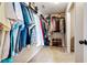 Walk-in closet with carpet and rods for hanging clothing at 2600 Reece Farms Sw Trl, Powder Springs, GA 30127