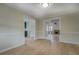 Light filled dining room with beautiful hardwood floors and views of the living room and kitchen at 4131 Carroll Sw St, Covington, GA 30014