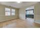 Dining room view into kitchen and large window, showcasing natural light and hardwood floors at 4131 Carroll Sw St, Covington, GA 30014